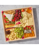 Connoisseur's Choice Cheese board artisanal cheeses sliced and arranged with assorted spreads fresh fruit and herbs