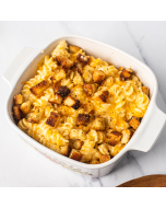 Oblique overhead view of fusilli mac and cheese in a square, white bowl, topped with toasted bread crumbs