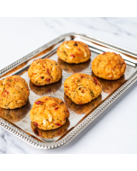Oblique overhead shot of seasoned Miniature Crabcakes served on a silver platter