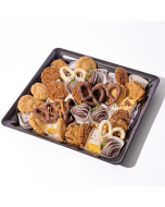 Overhead view of various sweets arranged in a black plastic serving tray.  Including chocolate covered pretzels, miniature brownies, miniature lemon bars, chocolate covered strawberries, and sugar cookies