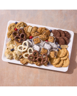 Overhead view of various sweets arranged in a black plastic serving tray.  Including chocolate covered pretzels, miniature brownies, chocolate chip cookies, peanut butter cookies, oatmeal cookies, and sugar cookies
